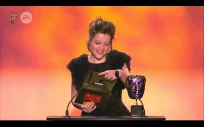 Georgie Henley presents an award at BAFTA